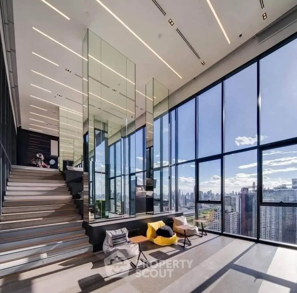 Luxurious modern living room with panoramic city views and stylish interior design.