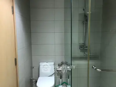 Modern bathroom with glass shower and sleek tile design