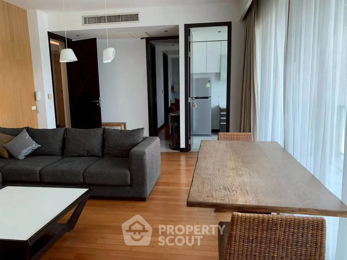 Modern living room with wooden flooring and stylish furniture