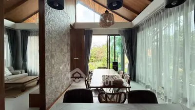 Stunning open-layout living and dining area with high ceilings and natural light.