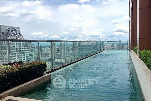 Luxurious rooftop pool with stunning city skyline views, perfect for relaxation and leisure.