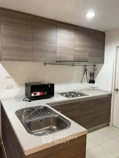 Modern kitchen with sleek cabinetry and built-in appliances