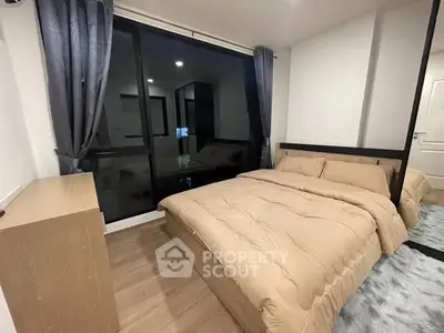 Cozy modern bedroom with large window and stylish decor