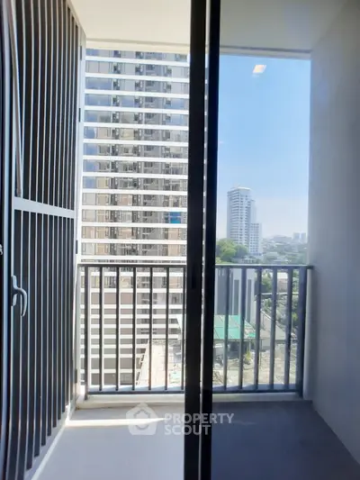 Modern balcony with city view in high-rise apartment