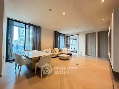 Spacious modern living room with elegant dining area and city view.