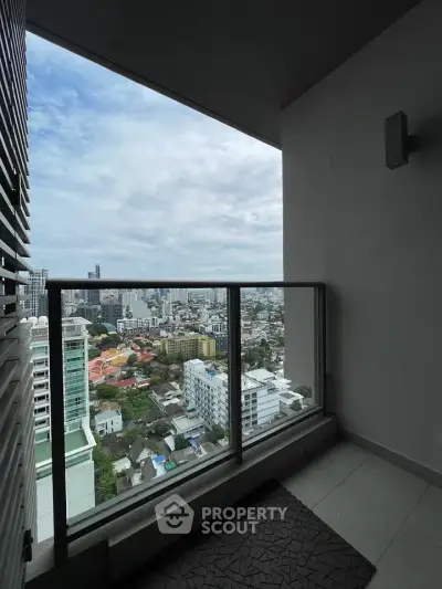 Stunning cityscape view from a modern high-rise balcony, perfect for urban living enthusiasts.