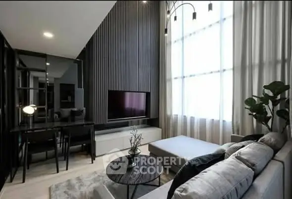 Modern living room with high ceilings and stylish decor