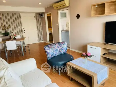 Spacious living room with modern decor and open layout, perfect for relaxation and entertainment.