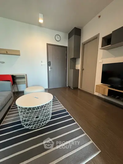Modern living room with stylish decor and sleek furniture, featuring a cozy ambiance and contemporary design.