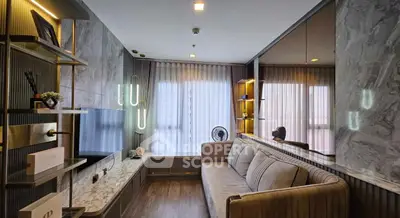 Modern living room with stylish decor and large windows for natural light.