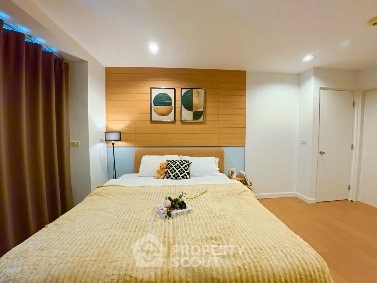 Cozy modern bedroom with stylish decor and warm lighting