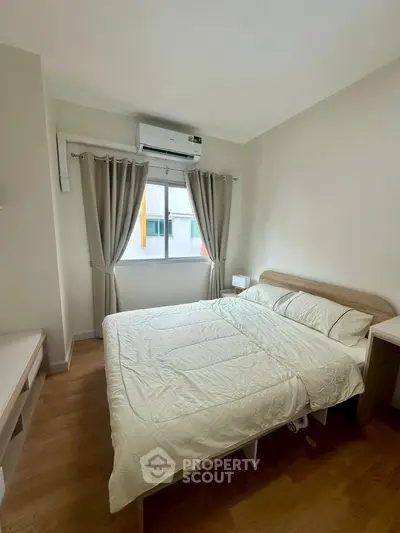 Cozy bedroom with modern decor and natural light