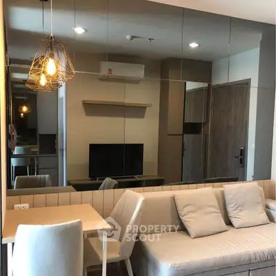 Modern living room with stylish decor and mirrored wall
