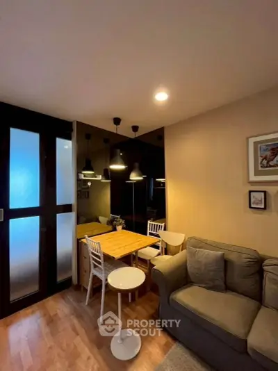 Cozy living room with modern lighting and comfortable seating