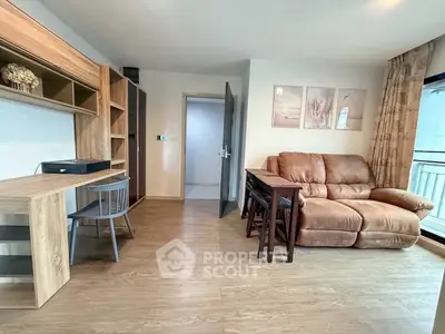 Cozy living room with wooden flooring and comfortable seating