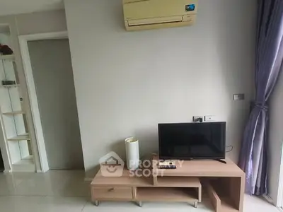 Modern living room with air conditioning and TV unit, sleek design.