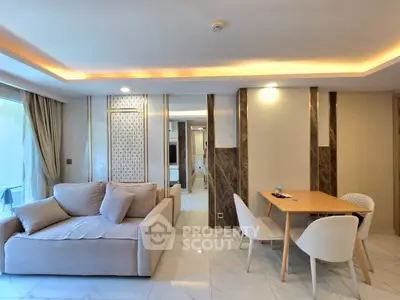 Modern living room with elegant decor and cozy seating area, featuring stylish lighting and marble flooring.