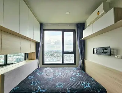 Modern bedroom with city view, featuring stylish cabinetry and air conditioning.