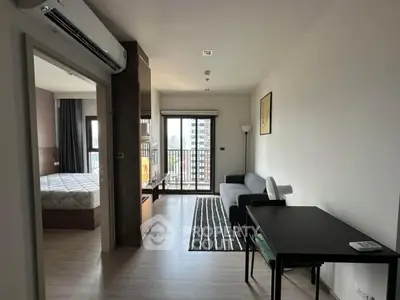 Modern apartment with cozy living room and bedroom, featuring city view and stylish decor.