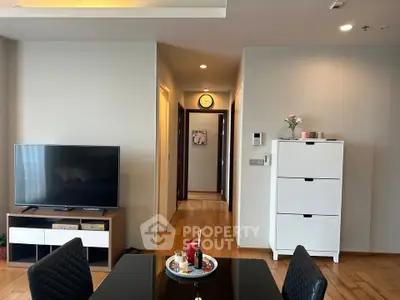 Modern living room with sleek furniture and wooden flooring
