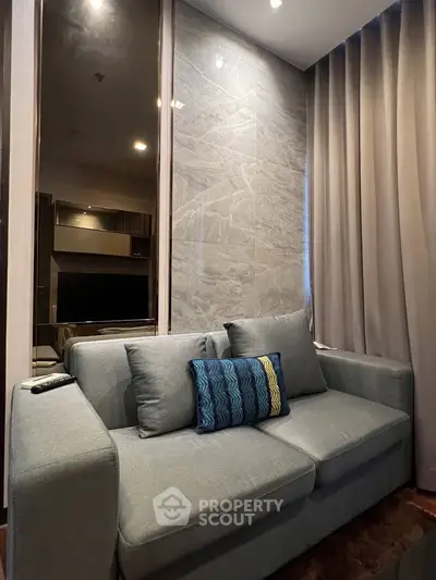 Modern living room with stylish gray sofa and elegant decor