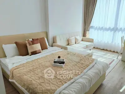 Bright and cozy bedroom with modern decor and ample natural light