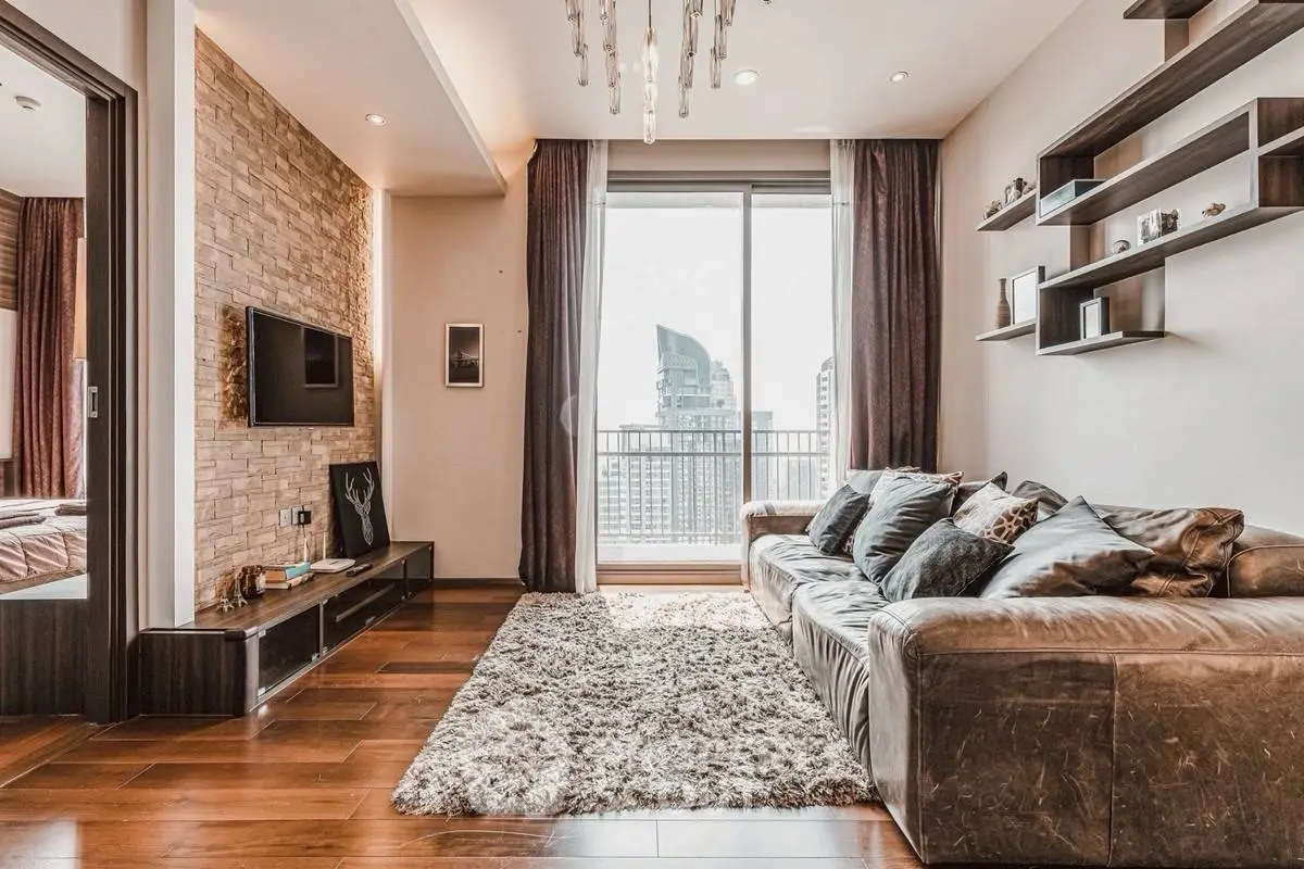 Luxurious living room with modern decor and city view balcony