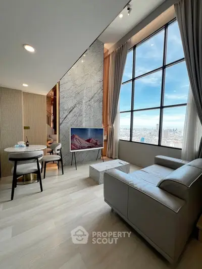 Luxurious modern living room with high ceilings and panoramic city views