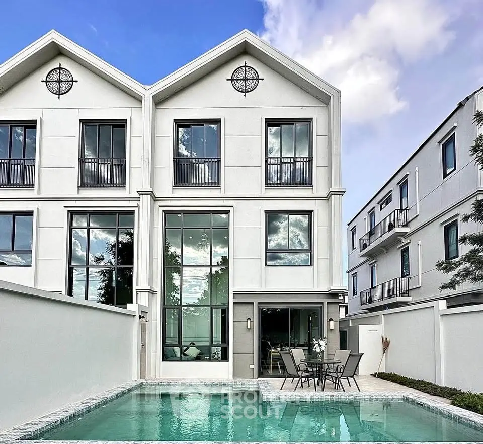 Luxurious modern townhouse with private pool and elegant facade, perfect for upscale living.
