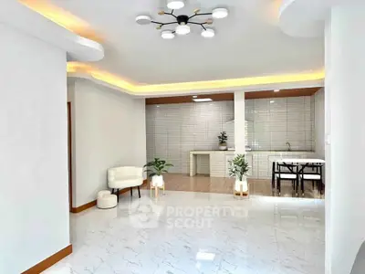 Spacious modern living room with open layout and elegant lighting