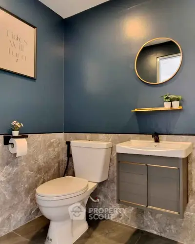 Modern bathroom with stylish decor and sleek fixtures.