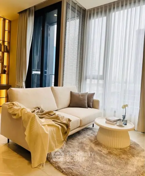 Elegant living room with cozy sofa and modern decor in a bright apartment