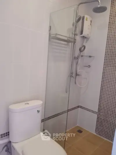 Modern bathroom with glass shower and tiled walls