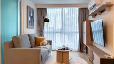 Modern living room with stylish decor and large window view