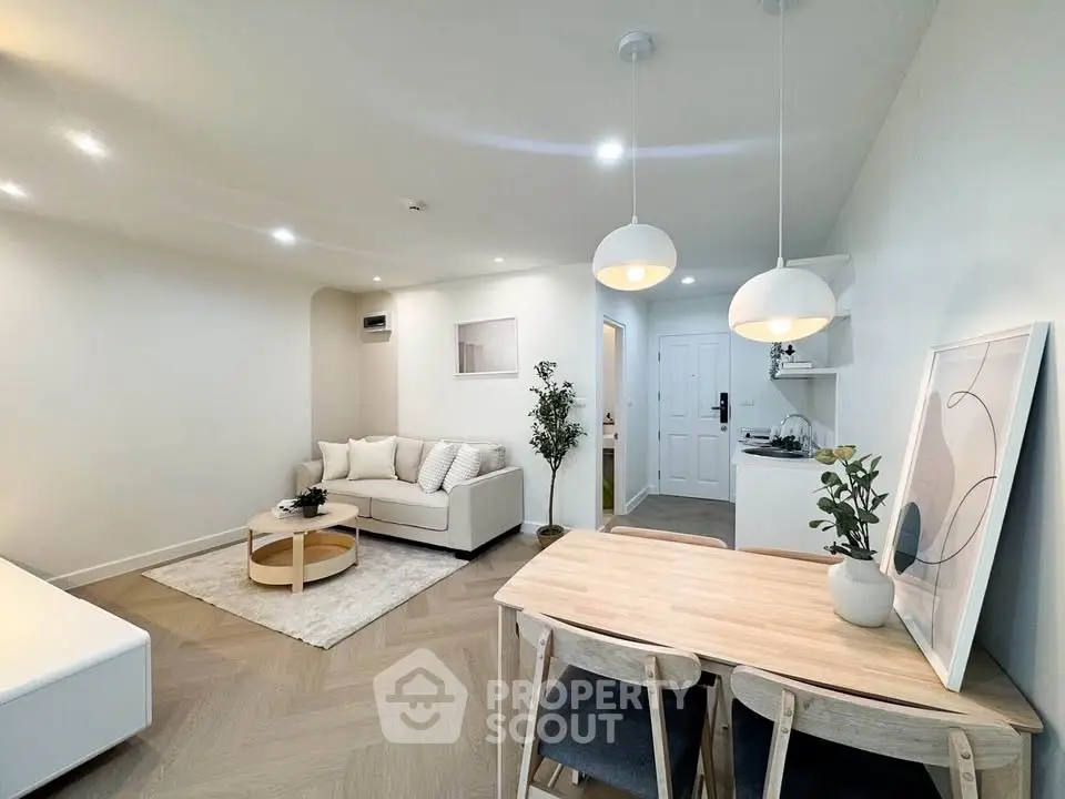 Modern living room with stylish decor and open dining area