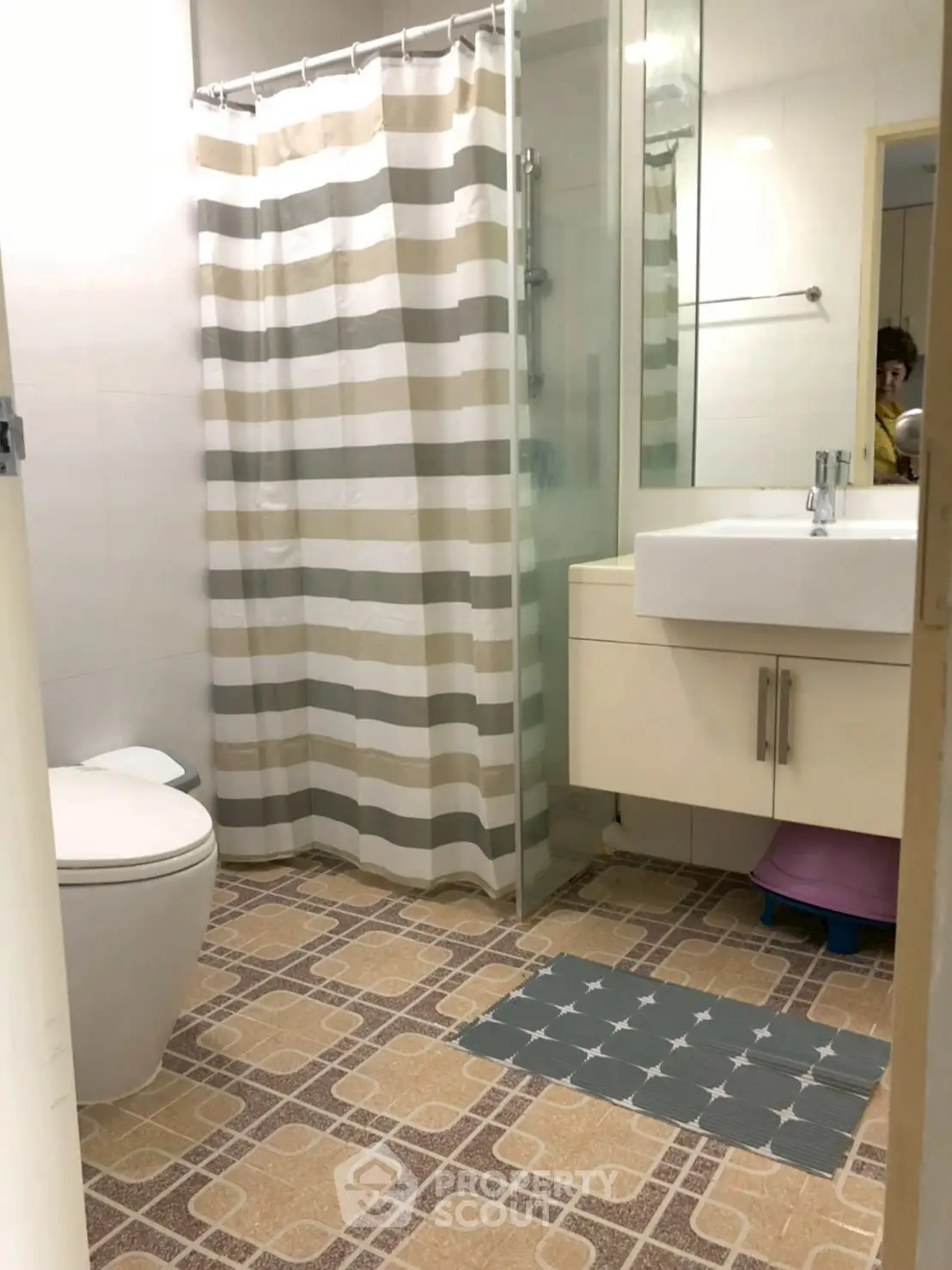 Cozy bathroom with modern shower and stylish sink in a contemporary home.