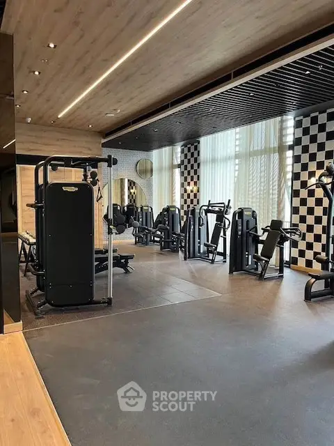 Modern gym with state-of-the-art equipment and stylish interior design.