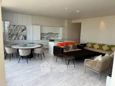 Luxurious open-plan living room with modern kitchen and stylish furniture