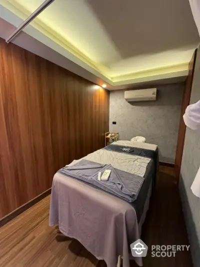 Luxurious spa room with massage tables and ambient lighting