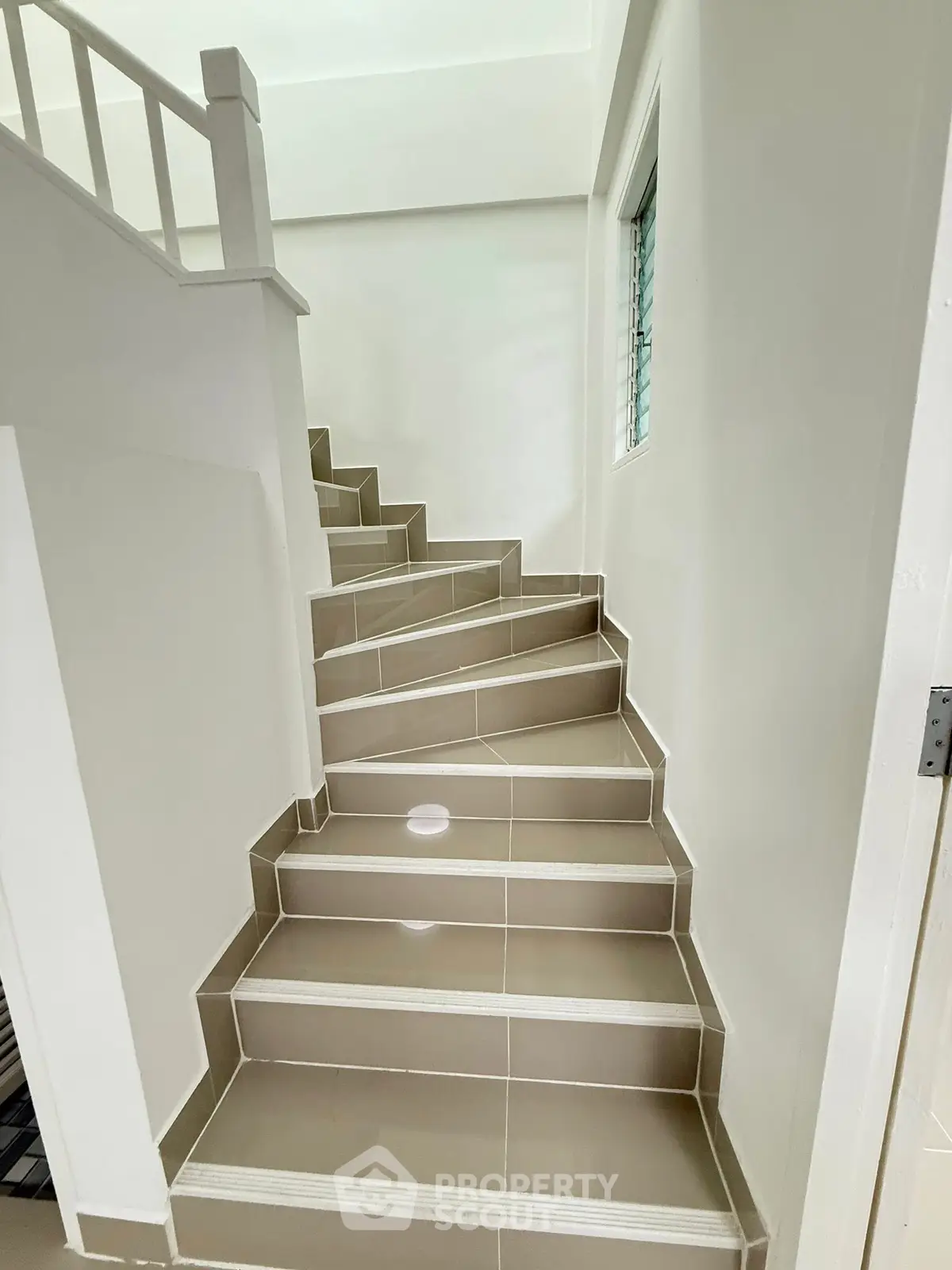 Modern staircase with sleek tile design in a contemporary home