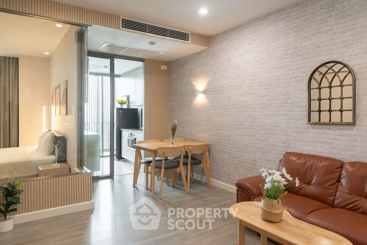 Modern living room with open layout, stylish decor, and cozy seating area in a contemporary apartment.