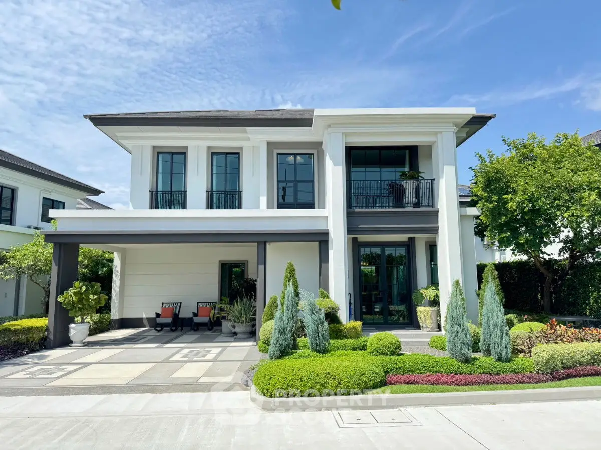 Stunning modern two-story house with lush landscaping and elegant facade