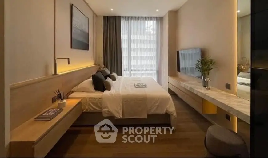 Luxurious modern bedroom with sleek design and large window view.
