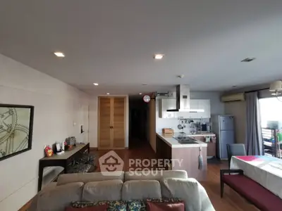 Spacious open-plan living room with modern kitchen and dining area