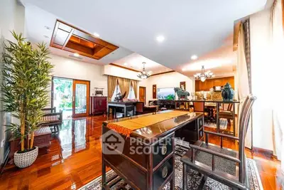 Luxurious open-plan living room with elegant wooden flooring and stylish decor.
