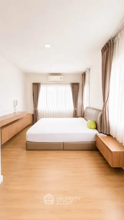 Spacious bedroom with modern design and natural light