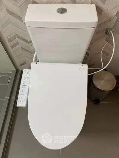Modern bathroom with high-tech toilet and sleek design