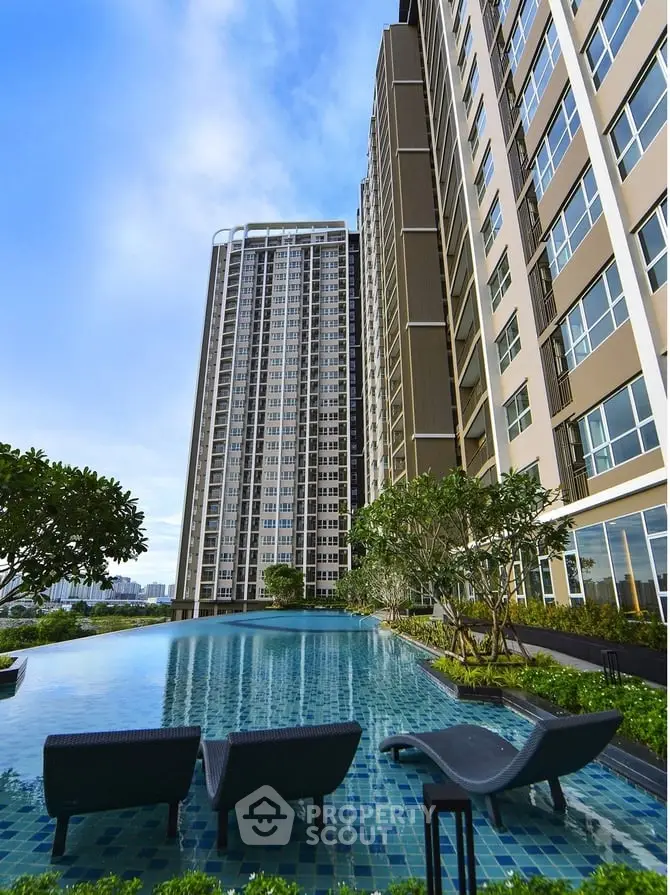 Luxurious high-rise apartment with stunning poolside view and modern architecture.