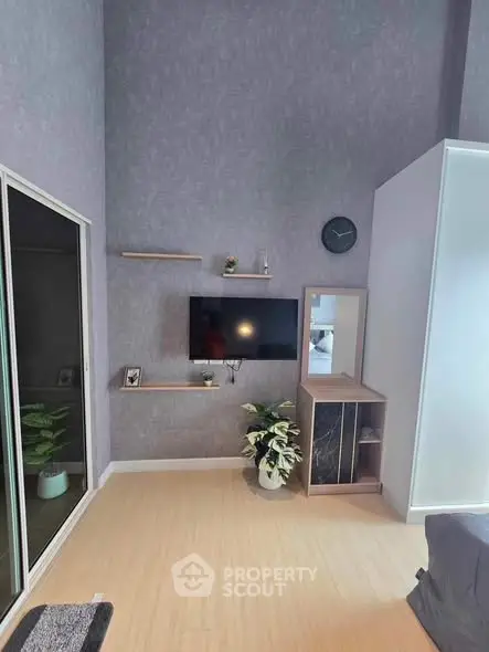 Modern living room with high ceiling and stylish decor