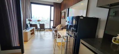 Modern apartment with open layout and city view, featuring stylish living area and kitchen.